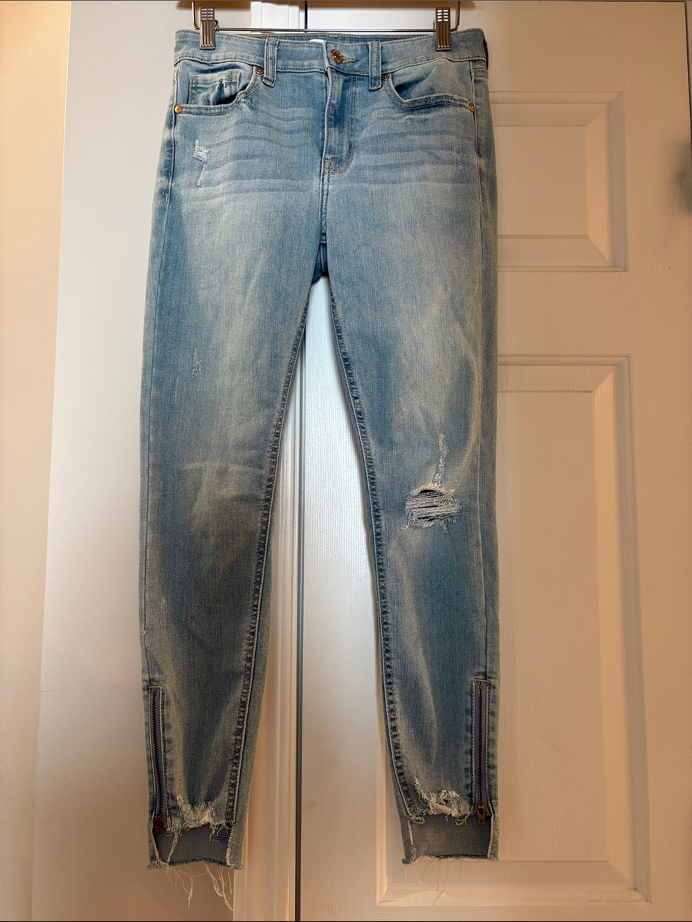 Light Blue Distressed Skinny Jeans with Ankle Zip Detail